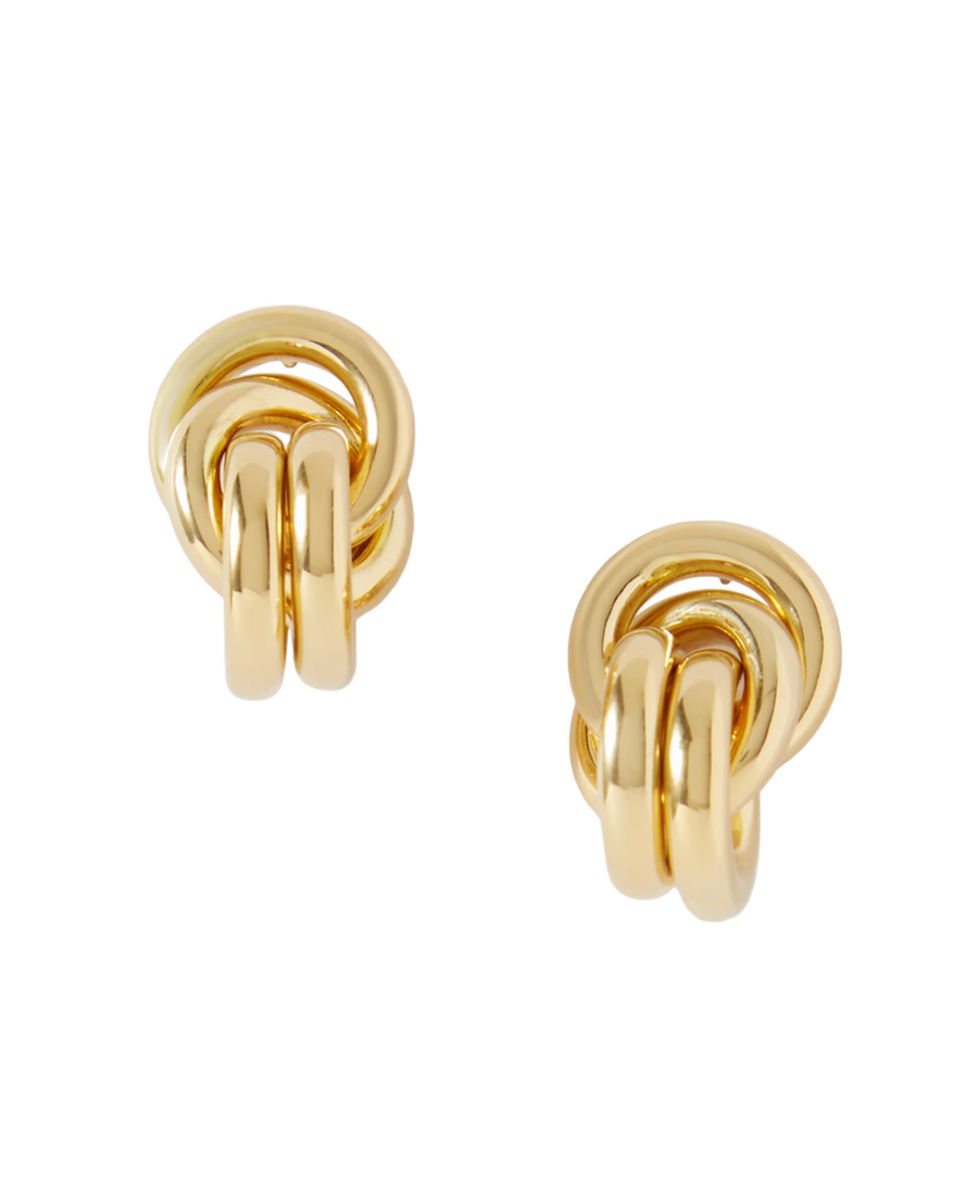 Pair of gold knot earrings on a light gray background